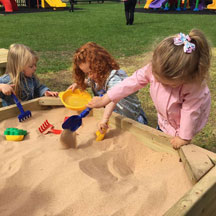 Playing in sandpit at Caego Day Nursery