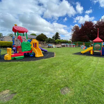 Outdoor slide and play area at Caego Day Nursery