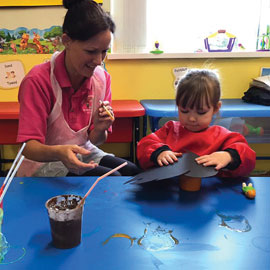 Member of staff with child at Caego Day Nursery
