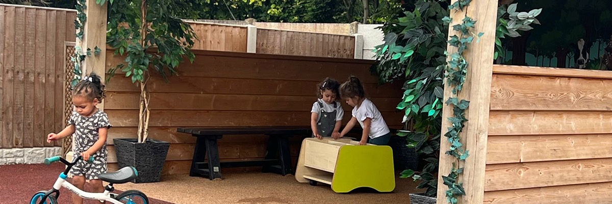 Children playing outdoors at Caego Day Nursery