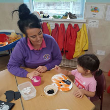 Child with member of nursery staff