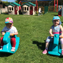 Children on outdoor play equipment